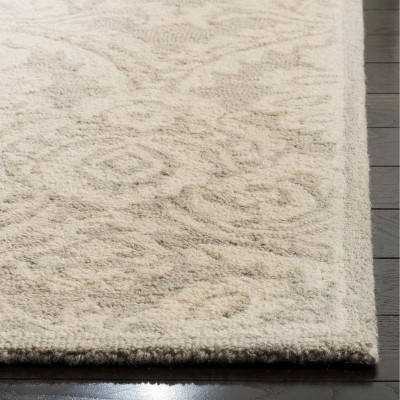 Silver and Ivory Handmade Wool 6' x 9' Tufted Area Rug