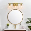 Elegant Lighting Merrick 3 light Brass and Clear Bath Sconce - 3 of 4