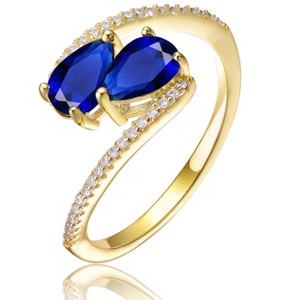 Guili Elegant Sterling Silver 14K Gold-Plated Bypass Ring with Emerald Cubic Zirconia for a Chic, Timeless Sparkle. Green or Blue, Sizes 6-8. - 1 of 3