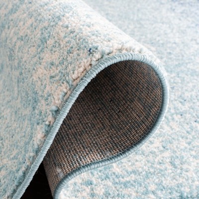 Madison Blue and Turquoise Synthetic Area Rug