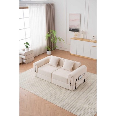 Cream sofa with back cushions and wall paneling