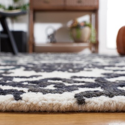Handmade Black and Ivory Wool Floral 8' x 10' Rug