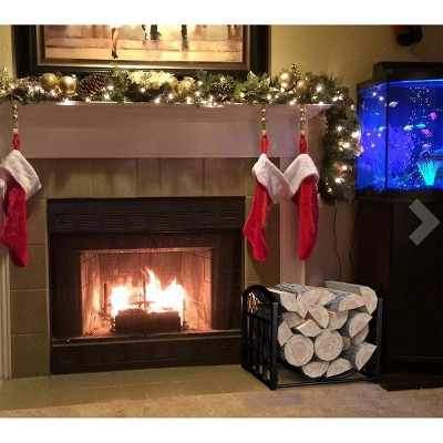 Black Curved Metal Firewood Rack with Decorative Scroll Design