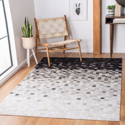 Handmade Black and Ivory Geometric Cowhide Area Rug
