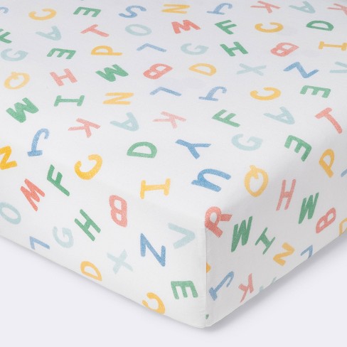Fitted Crib Sheet Alphabet - Cloud Island™ - Primary Colors - image 1 of 4