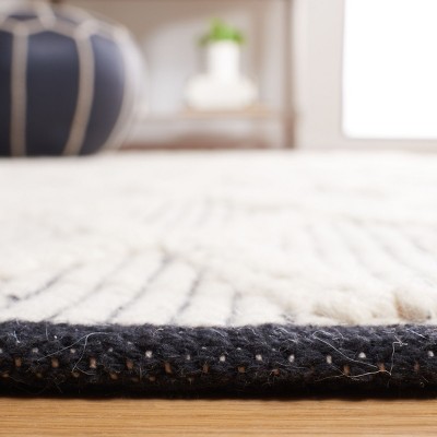 Handmade Black and Ivory Wool Diamond 6' x 9' Area Rug