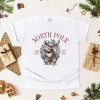 Simply Sage Market Women's North Pole Reindeer Oval Wreath Short Sleeve Garment Dyed Tee - 3 of 4