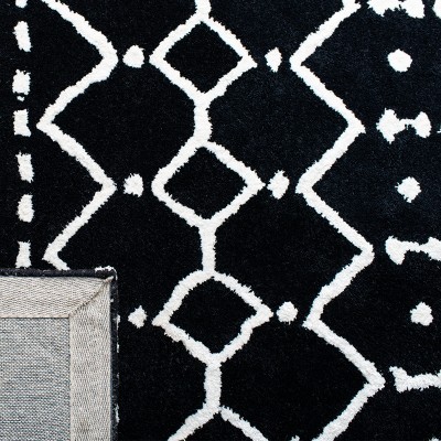 Black and Ivory 6' x 9' Tufted Wool Area Rug