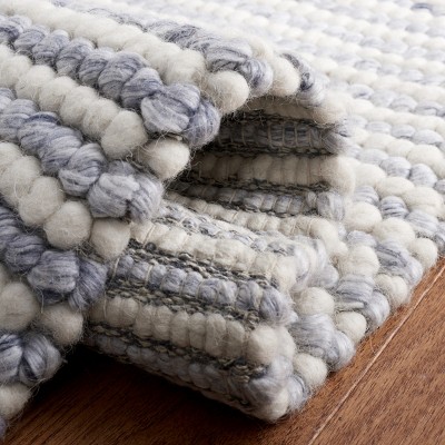 Handmade Ivory and Blue Wool Rectangular Area Rug 4' x 6'