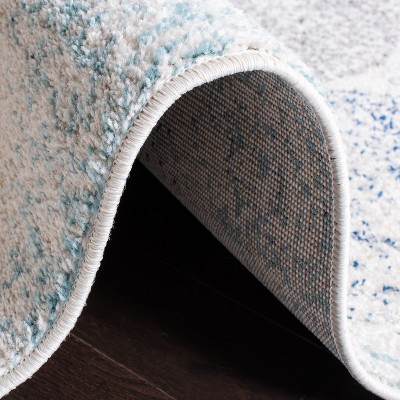Ivory and Blue Geometric Pattern Rectangular Synthetic Rug