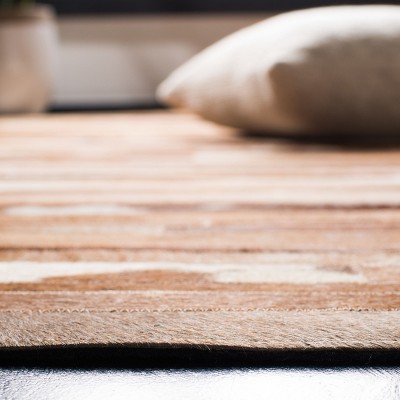 Handwoven Tan and Ivory Geometric Cowhide Area Rug