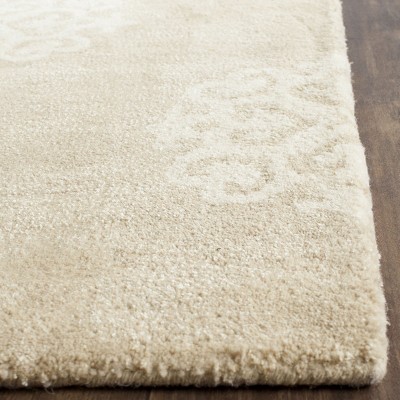 Beige and Ivory Tufted Wool and Viscose 9' x 12' Area Rug
