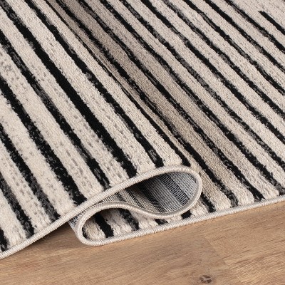 Cream and Black Synthetic Flat Woven 5' x 7' Area Rug