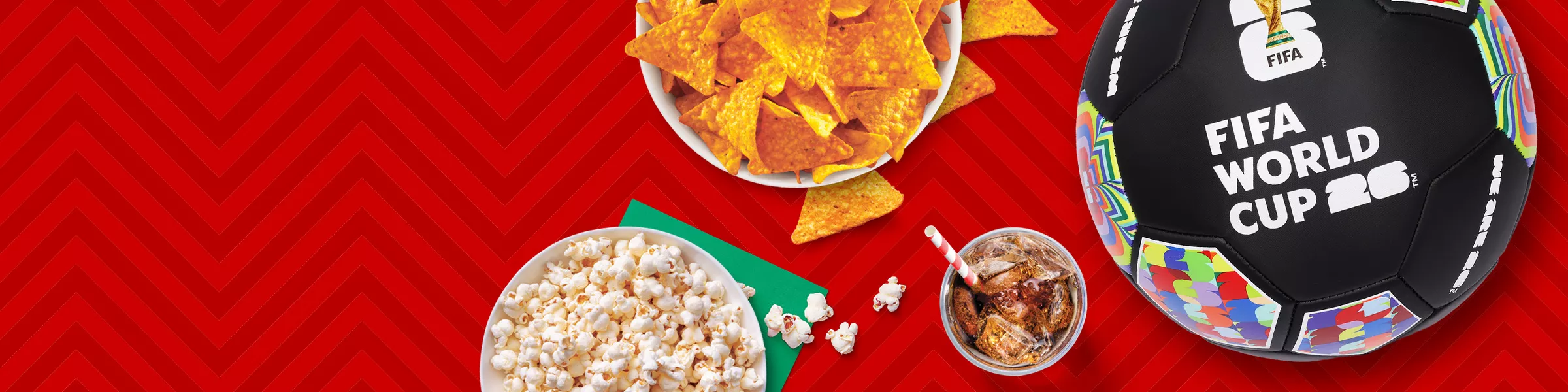 A FIFA World Cup soccer ball sits on a patterned zig-zagged striped red background next to a glass of soda. The soccer ball swaps out for a bowl of buffalo wings and celery. A bowl of doritos and popcorn next to it swaps out to Chips Ahoy and Toll House cookies.