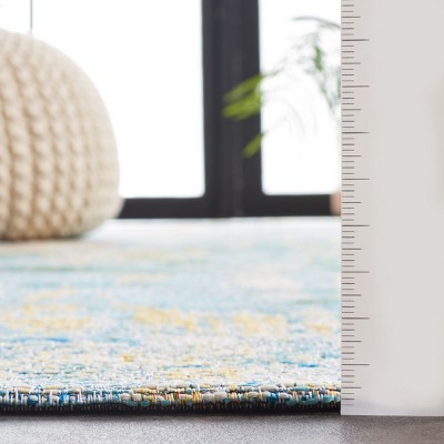Reversible Light Blue Synthetic 4' x 6' Stain-Resistant Area Rug