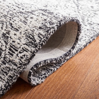 Black and Ivory Geometric Wool 3' x 5' Area Rug