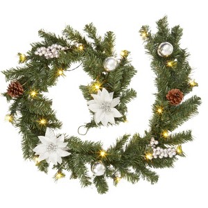 6-foot pre-lit Christmas wreath with 20 lights, pine cones, red berries, and poinsettias, suitable for indoor/outdoor decoration. - 1 of 4