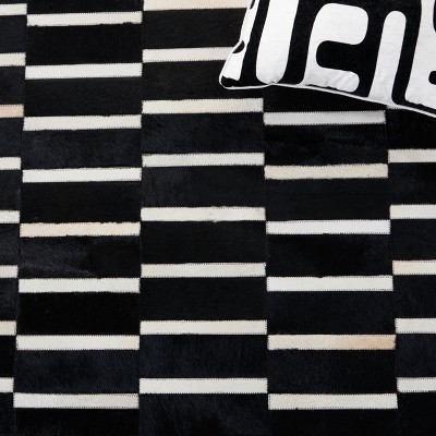 Handmade Black and Beige Geometric Cowhide Area Rug