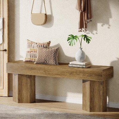 Bench used as hallway/entrance décor with pillows and decor