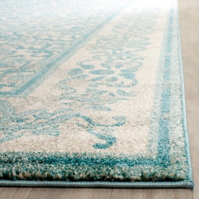 Ivory and Light Blue Floral Synthetic 8' x 10' Area Rug