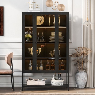 Tall black glass cabinet with shelves and bottles in living room