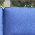 blue cushion/brown wicker