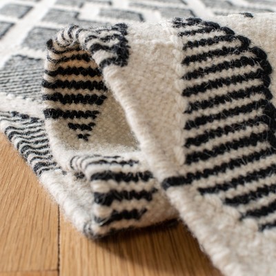 Nomadic Essence Handwoven Black and Cream Wool Area Rug, 5' x 8'