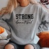Simply Sage Market Women's Graphic Sweatshirt Strong Is The New Beautiful - 2 of 3