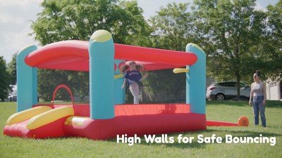 Enormous Red and Blue Inflatable Bounce House with Double Basketball Hoops