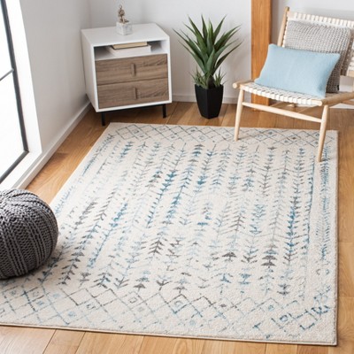 Ivory and Turquoise 6' x 9' Synthetic Area Rug