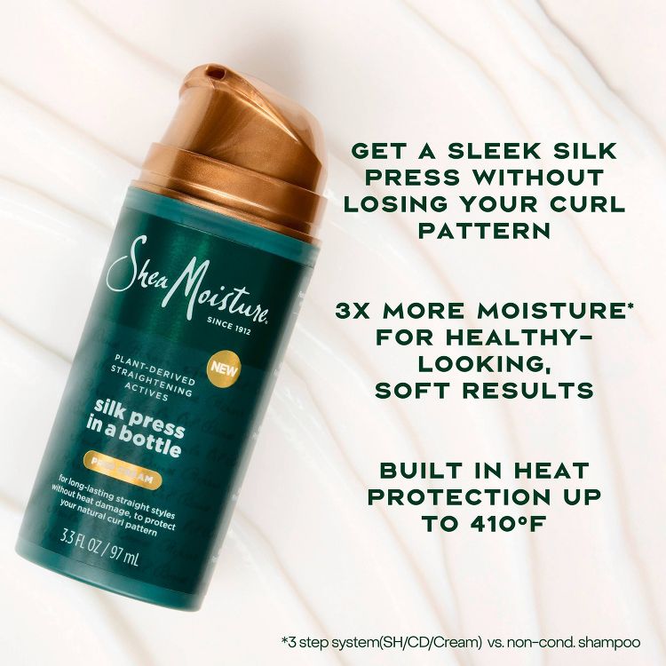 A bottle of SheaMoisture silk press treatment with text highlighting features like curl pattern retention, 3x more moisture, and heat protection up to 410°F.