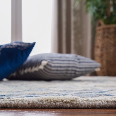 Elegant Ivory Wool 4' x 6' Hand-Tufted Rectangular Area Rug