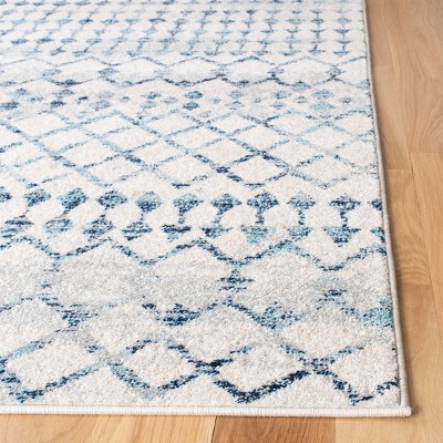 Ivory and Turquoise Geometric Synthetic Area Rug