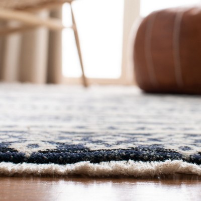 Ivory and Black 4' x 6' Hand-Knotted Oriental Rug