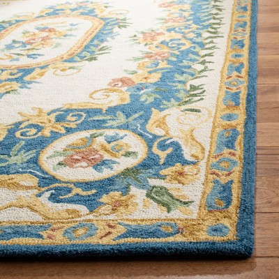 Handmade Cream and Blue Floral Wool Area Rug