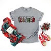 Simply Sage Market Very Merry Teacher Plaid Garment Dyed Tee - 3 of 4