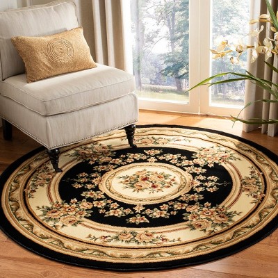 8' Round Black and Ivory Floral Synthetic Area Rug