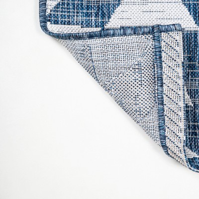 Ivory and Blue Geometric 4' x 6' Synthetic Area Rug