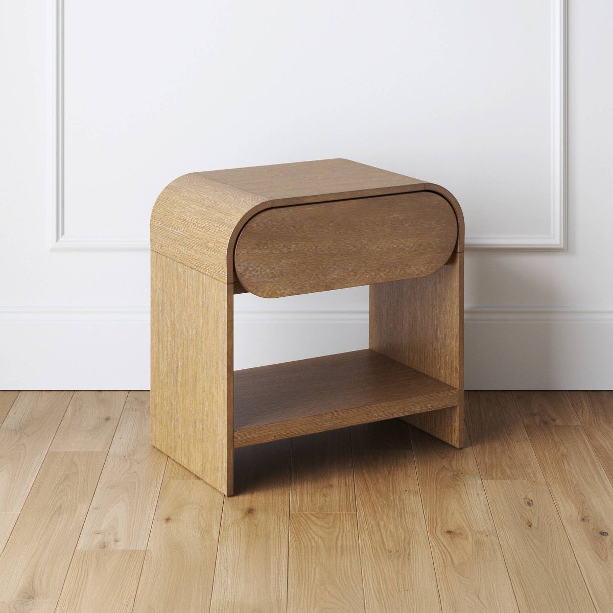 Light brown nightstand with curved top and rounded drawer-front