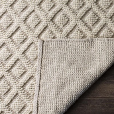 Ivory Handwoven Wool and Synthetic 5' x 8' Area Rug