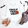 Simply Sage Market Women's Graphic Sweatshirt Trick Or Treat Vibes Pumpkin - 3 of 4