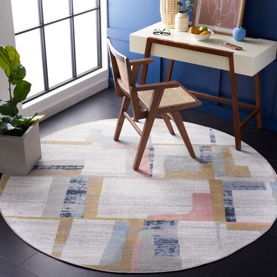 Ivory and Blue Rust Round Synthetic Area Rug, 6'7"