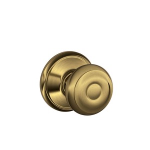Schlage Georgian Antique Brass Passage Lockset 1-3/4 in. - 1 of 1