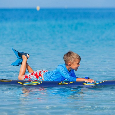 Yellow and Blue Foam Surfboard with Fins and Leash