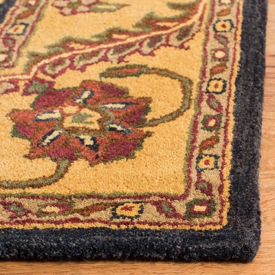 Elegant Jaipur Heritage Black and Gold 5' x 8' Wool Area Rug