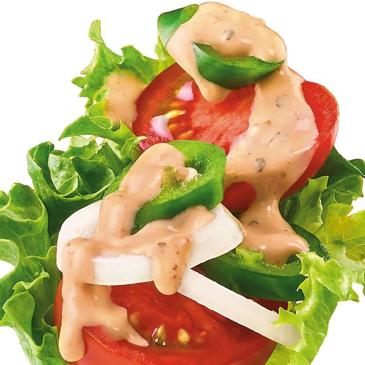 Lettuce, tomato, onion, and jalapeño slices topped with creamy dressing.