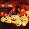 Tangkula 8Ft Long Halloween Inflatable Pumpkin Outdoor Blow Up Deco w/ 7 Pumpkins & 1 Black Cat Built-in Blower 4 Stakes LED Lighted Inflatable Prop - 3 of 4