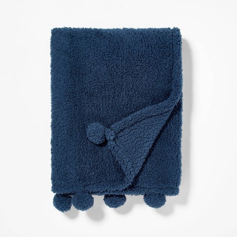 Navy throw with pom poms hot sale