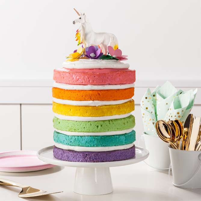 Unicorn Rainbow Cake
Prepare 1 package white cake mix for every 2 layers, adding a few drops of pastel gel food color for tinting each layer. Spread vanilla frosting between the cooled layers. Top with more frosting, add sprinkles, paper flowers and a toy unicorn topper.

Tip: Do not overbake; use the toothpick test.
