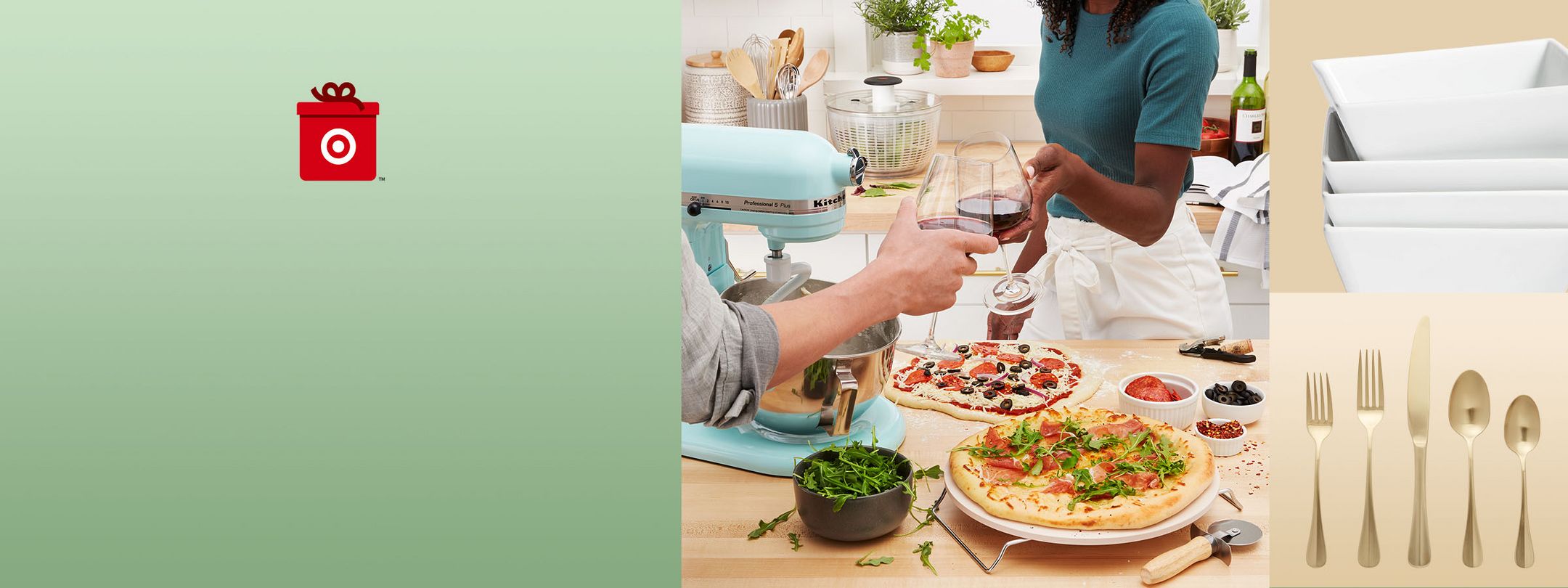Couple cheers after making homemade pizzas. Silverware and bowls in view. 